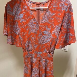 Orange and grey romper with tie back, pretty print!